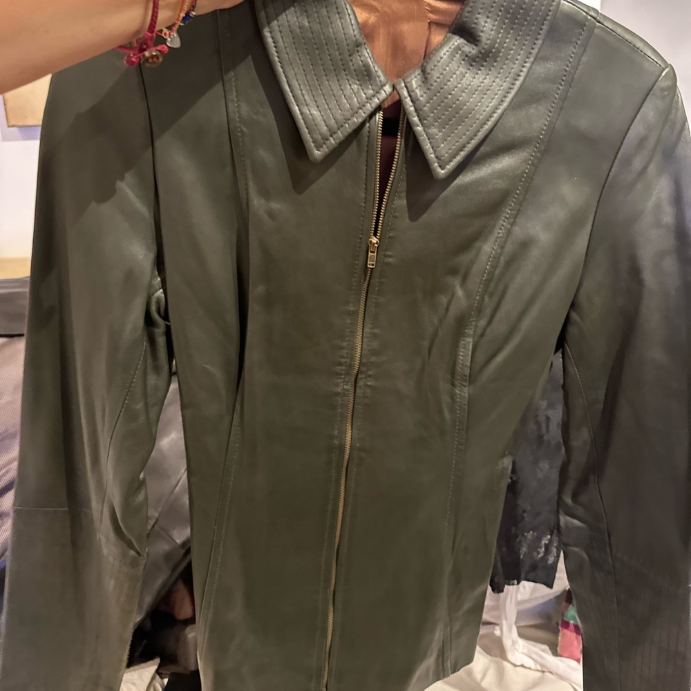 Leather jacket with leather belt. Jacket can be worn with or without belt.